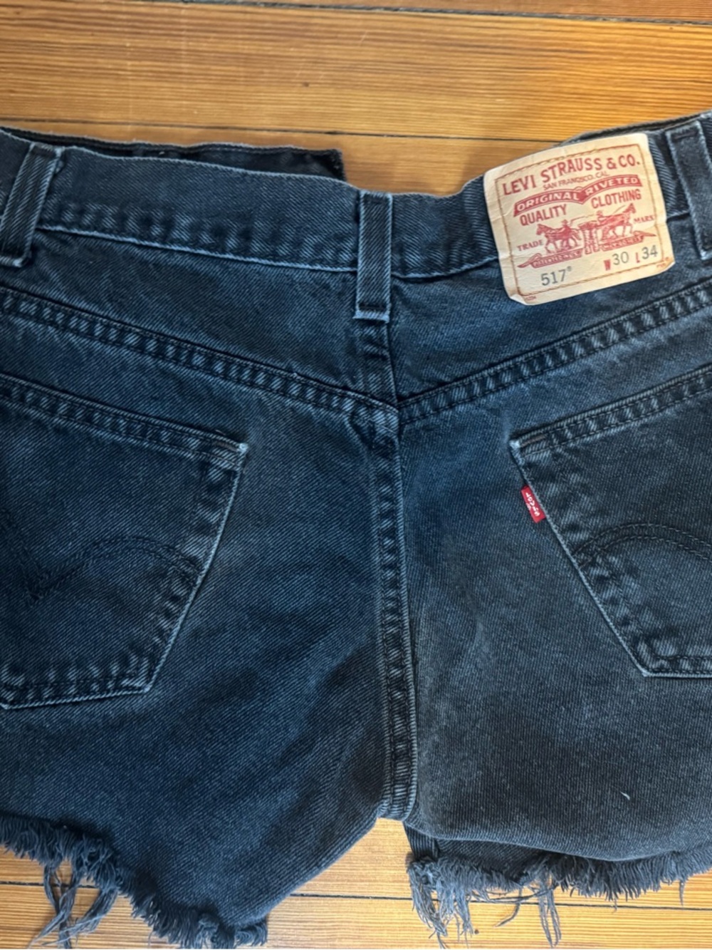 Levi's Black Denim Cutoff Shorts with Frayed Hem